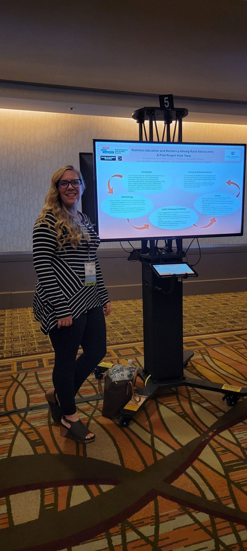 Brandi presenting her research at a conference